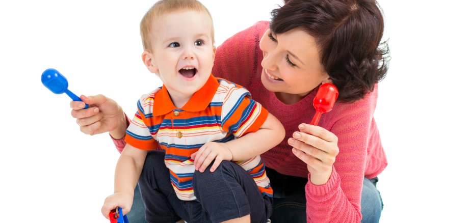 Mother,And,Baby,Boy,Having,Fun,With,Musical,Toys.,Isolated
