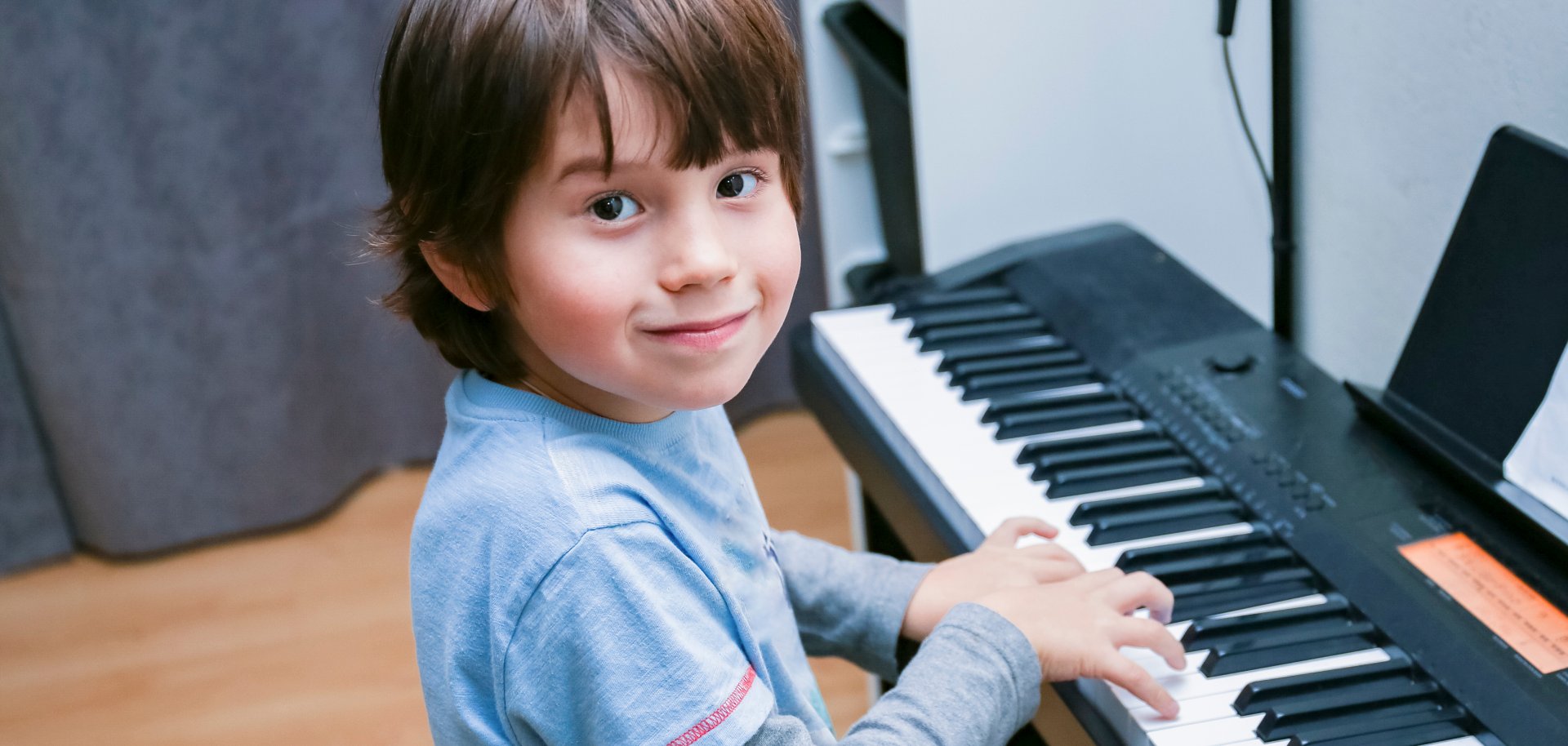 A,Boy,Of,Six,Years,Old,Is,Sitting,At,The