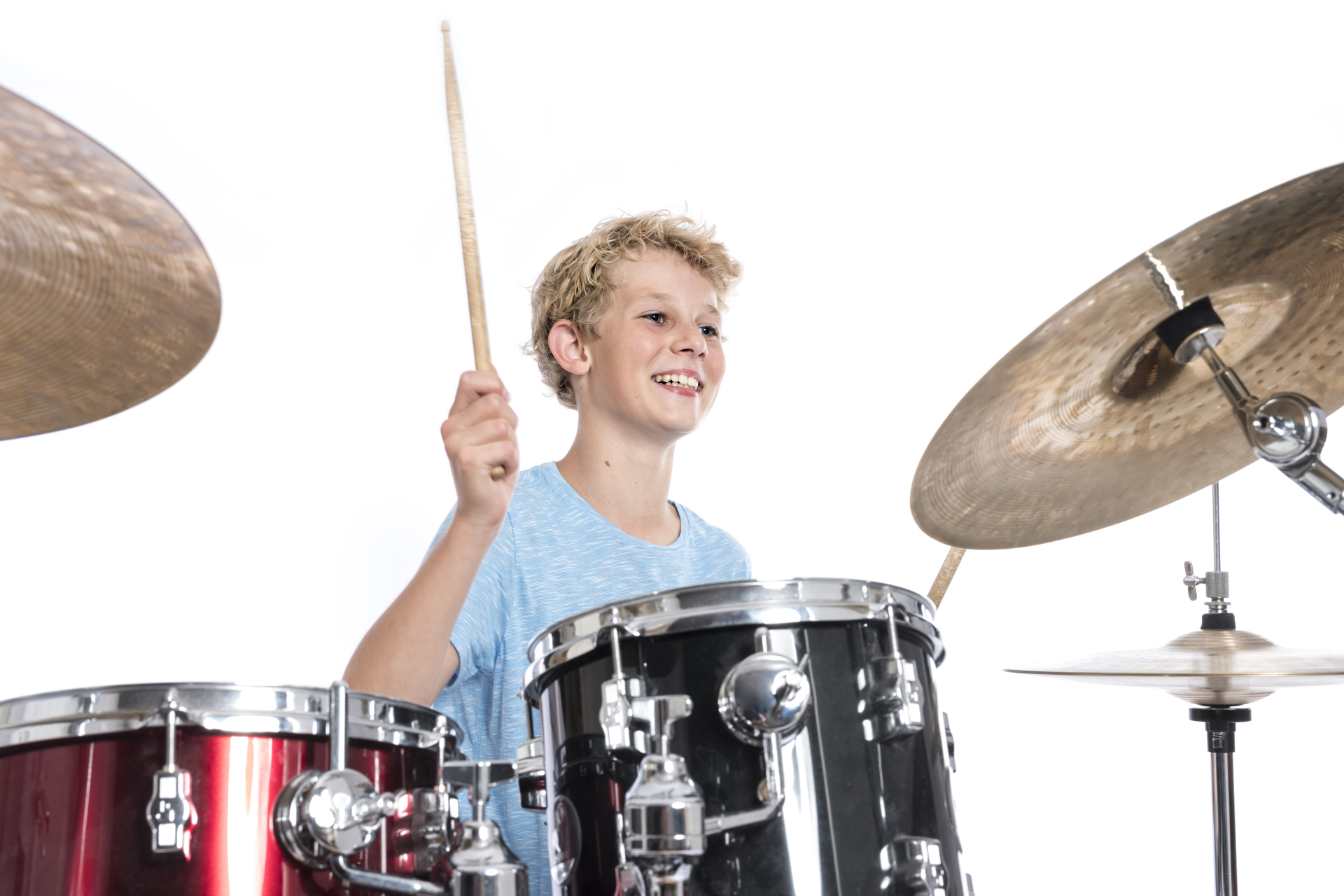 Blond,Teen,Boy,In,Blue,Plays,Drums,At,Drumkit,In